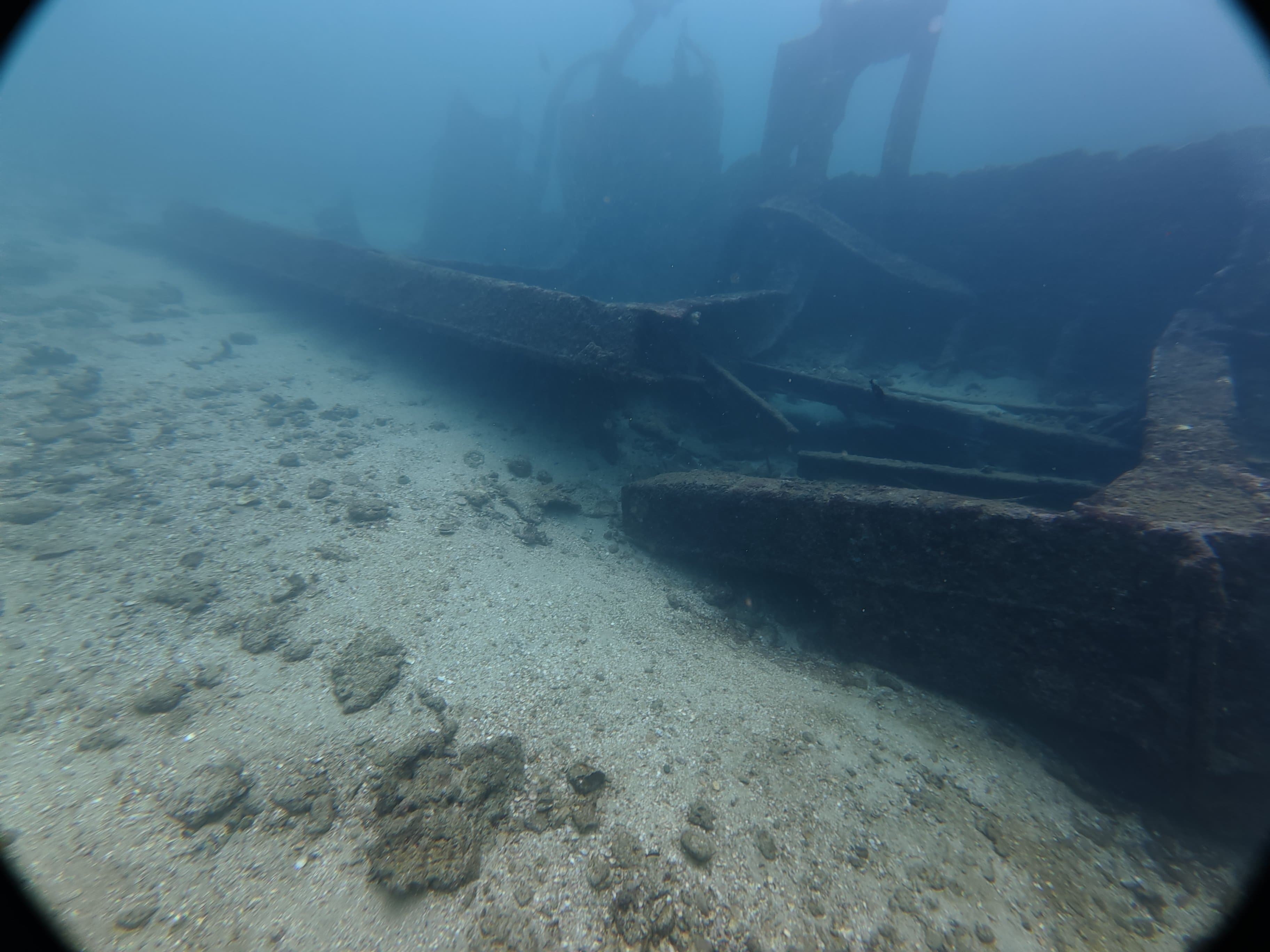Shipwreck resting on the sandy seabed near Unawatuna